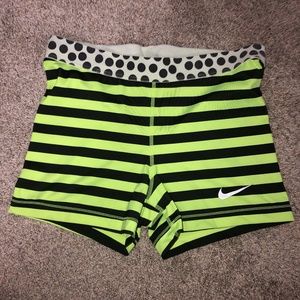 lime green and black nike pros